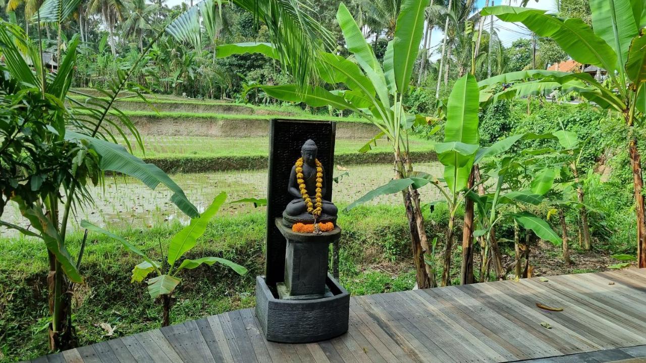 The Sebali Resort Ubud  Bagian luar foto A statue of the Buddha with a mala